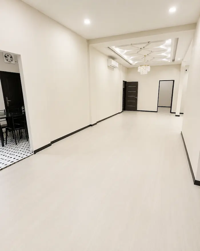 Completed light vinyl flooring installation in a residential interior